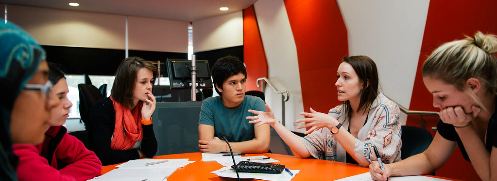 Students talking around a table