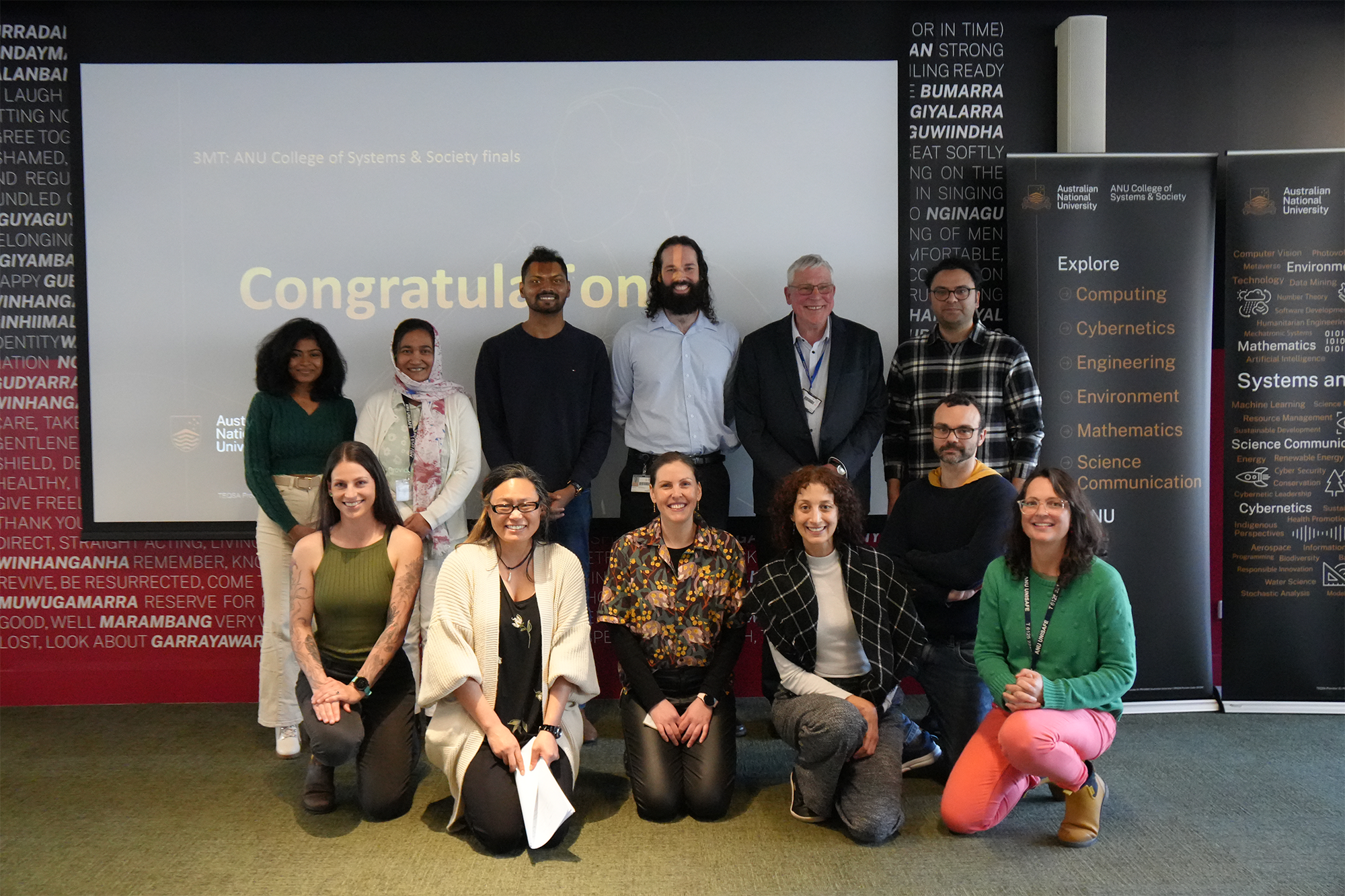 The ANU College of Systems and Society 2025 3MT final PhD candidates and judges. Back row from left to right: Anjalie Edirisooriya (School of Engineering PhD candidate), Sharmin Akter (Fenner PhD candidate), Buddhi Kothalawala (School of Computing PhD candidate), Lachlan McGinness (School of Computing PhD candidate), Dr Richard Greene (Fenner judge), and Dr Ehsan Nabavi (CPAS judge). Front row from left to right: Shoshana Rapley (Fenner PhD candidate), Professor Valeska Ting (College Interim Associate Dean HDR), Samantha Shippley (Fenner PhD candidate), Dr Bea Velasco (School of Engineering judge), Associate Professor Pascal Bercher (School of Computing judge), and Rachel Clarke (Fenner judge).
