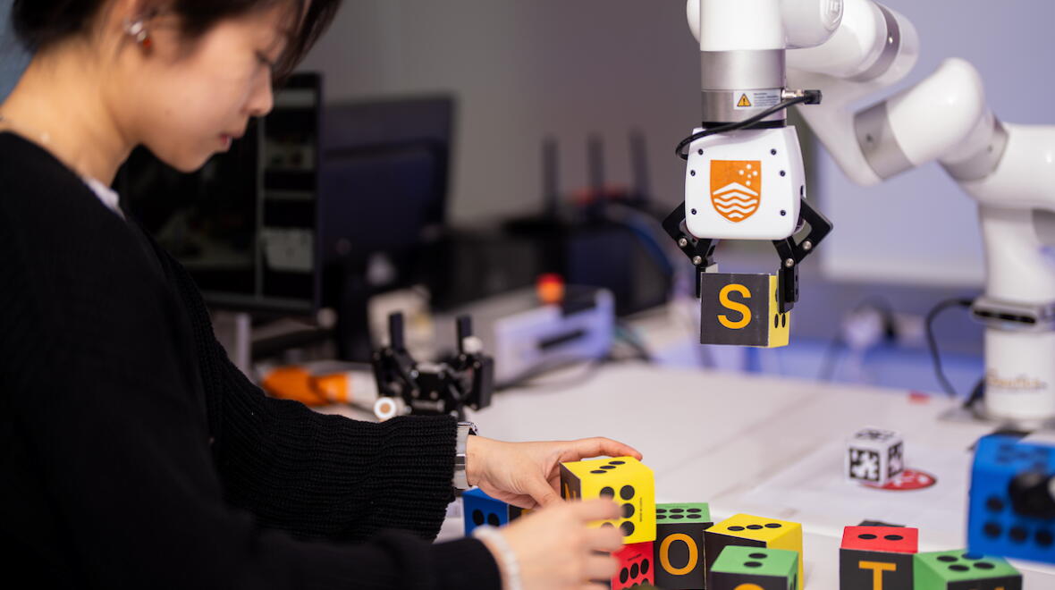 ANU student in the robotics lab